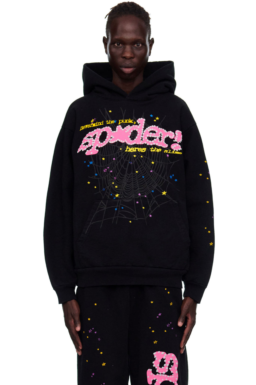 Black 23oz fleece hoodie with pink puff print "SP5DER" motif, web, and colorful star prints.