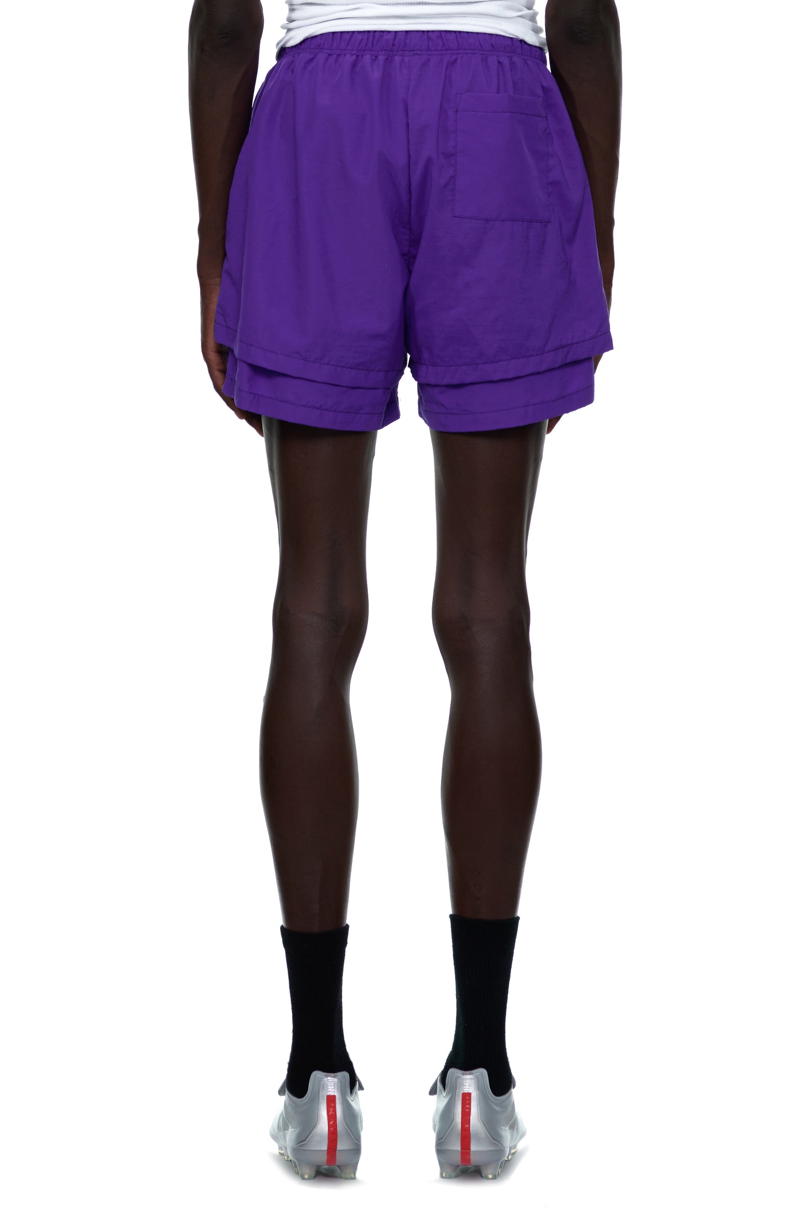 Purple nylon GRAPE LOGO SHORT with high-low double layer design and patch back pocket.