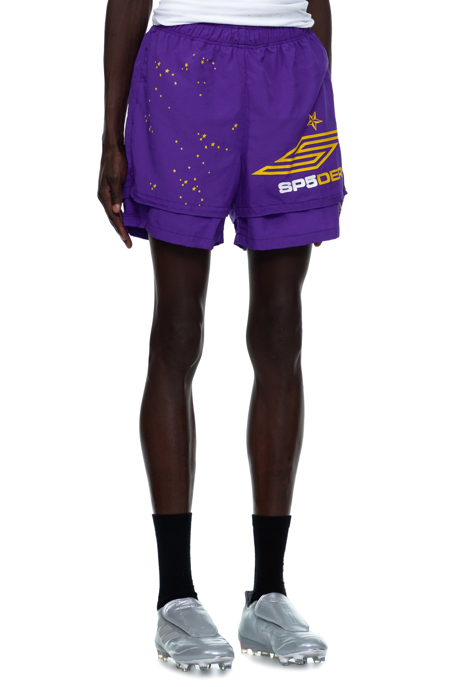 GRAPE SP5 PRO SHORT: Purple water-repellent nylon shorts with yellow star and SP5DER logo print, high-low double layer design.