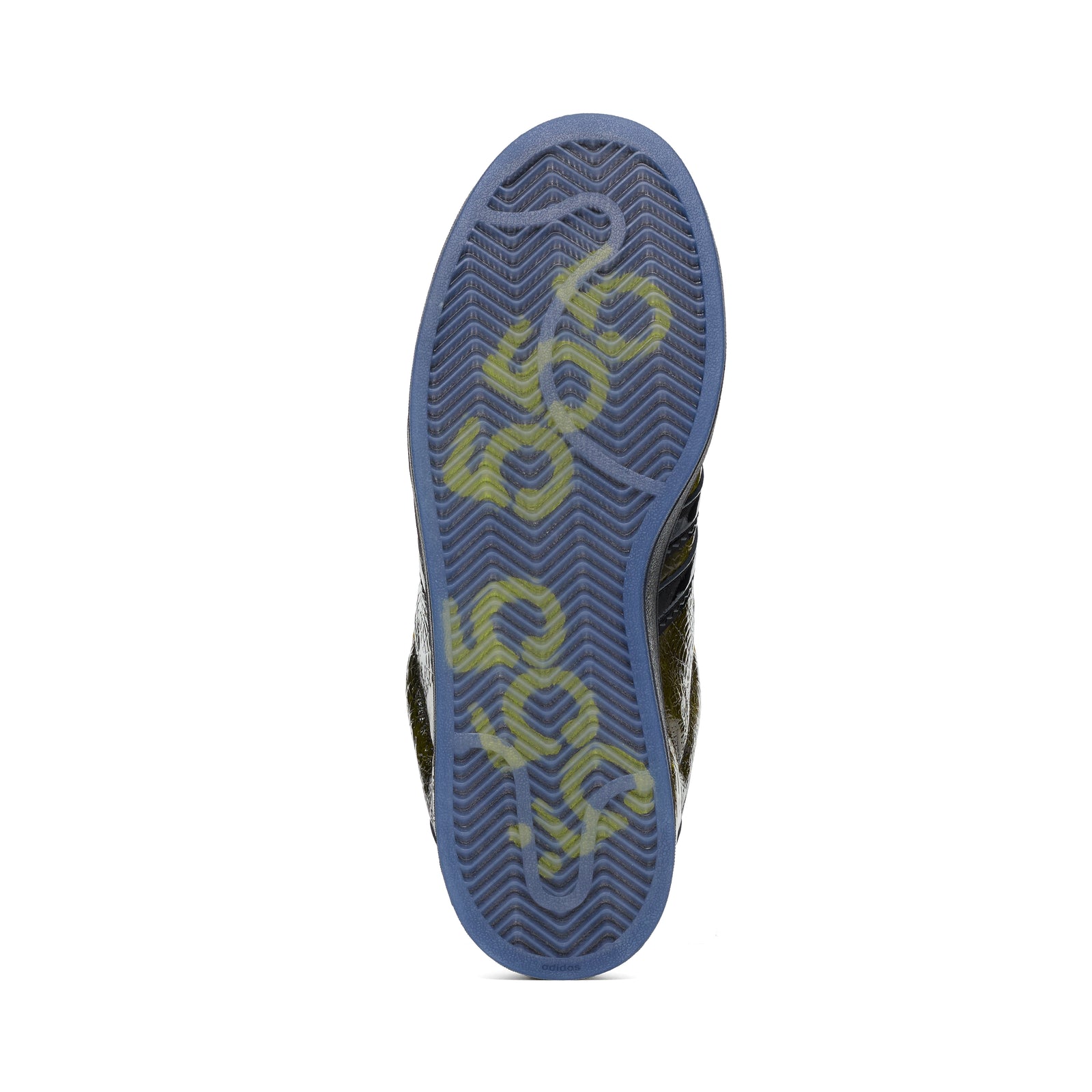 SP5DER x ADIDAS SUPERSTAR sneaker, showing its translucent blue rubber outsole with yellow graphic detailing.