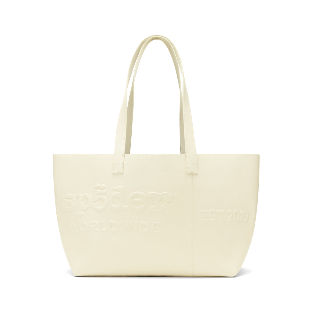 Ghost leather tote bag with embossed logo, "EST. 2019" detail, and dual shoulder straps.