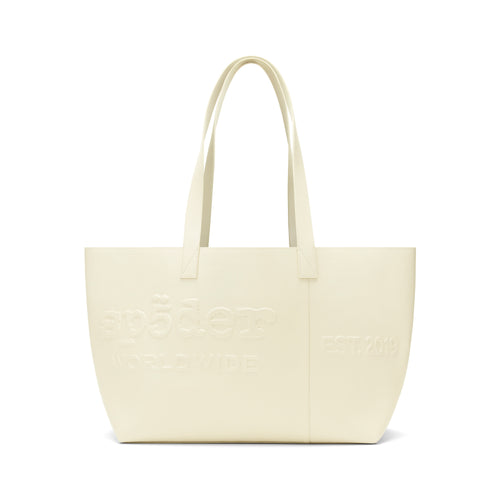 Ghost leather tote bag with embossed logo, "EST. 2019" detail, and dual shoulder straps.
