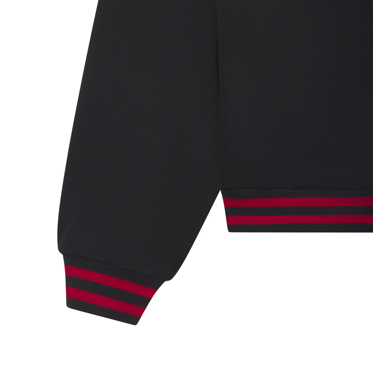 Black cotton fleece hoodie sleeve and hem featuring red and black striped ribbed cuffs.
