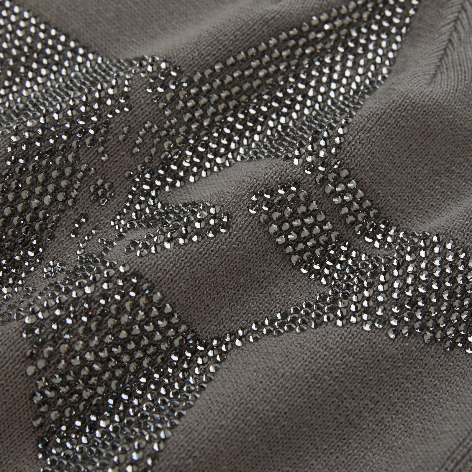 Gray acrylic skully with a sparkling rhinestone 5-star design.