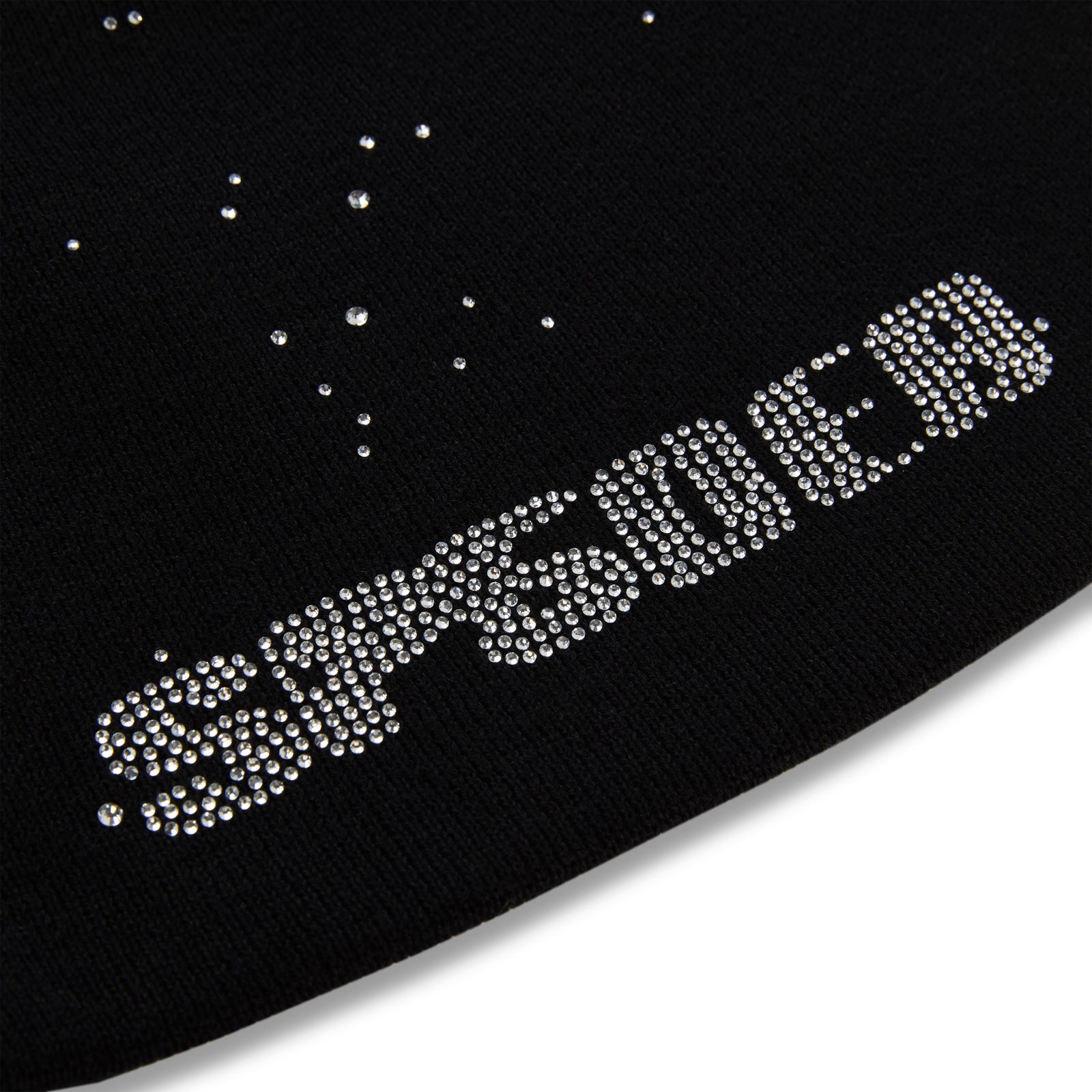 Black acrylic skully with "RHINESTONE" in clear rhinestones and scattered rhinestones.