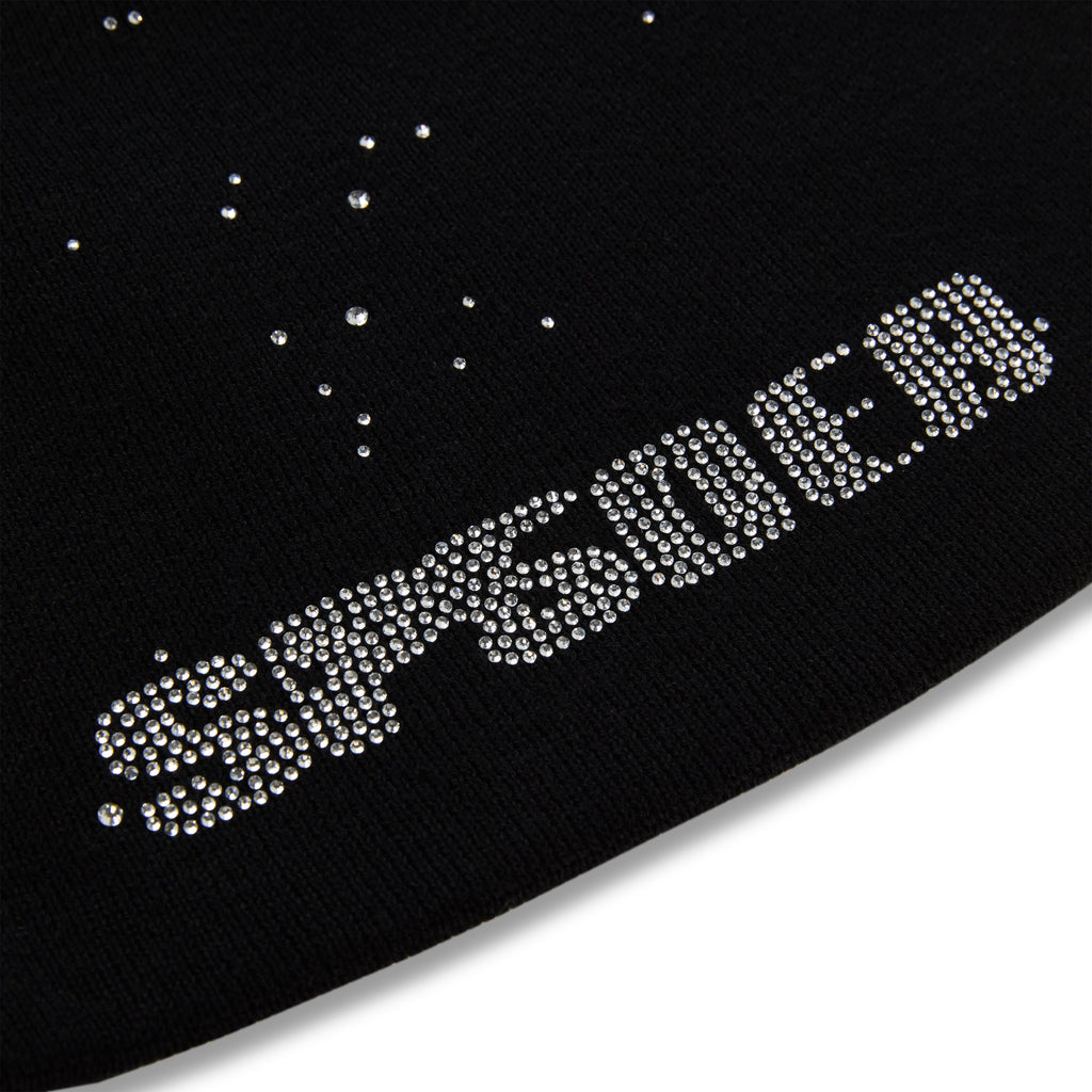 Black acrylic skully with "RHINESTONE" in clear rhinestones and scattered rhinestones.