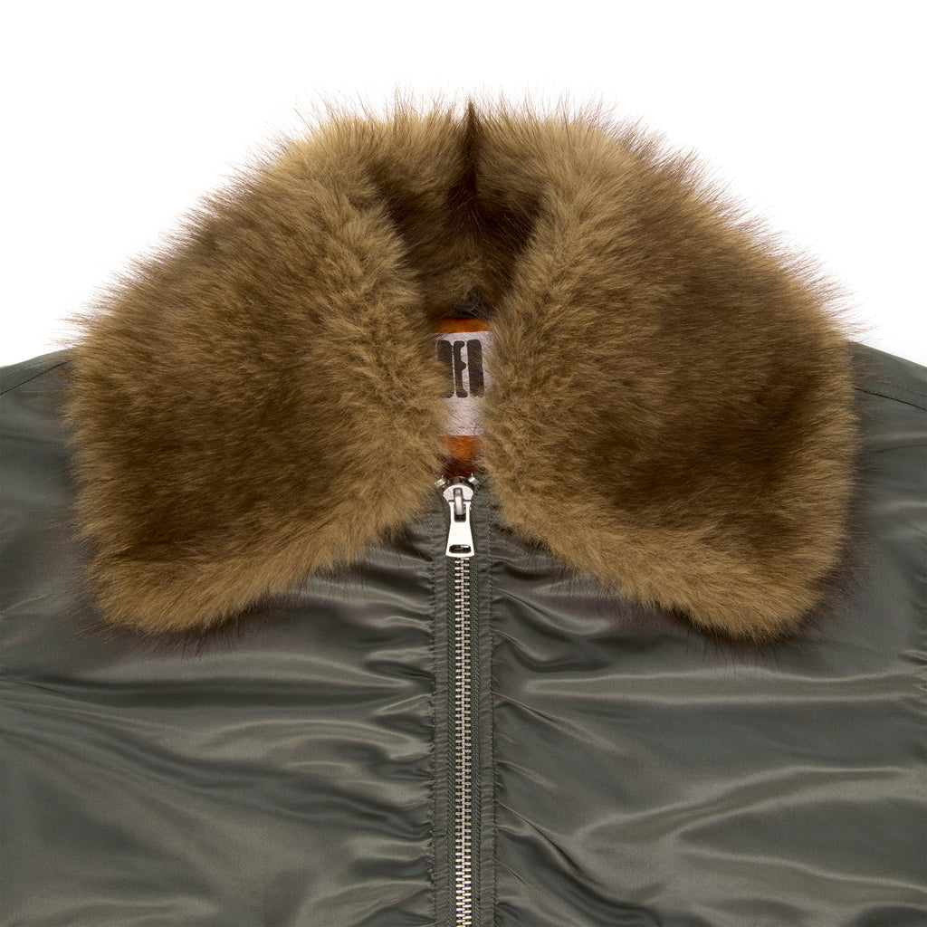 Olive green nylon bomber jacket with a detachable brown faux fur collar and silver zipper.
