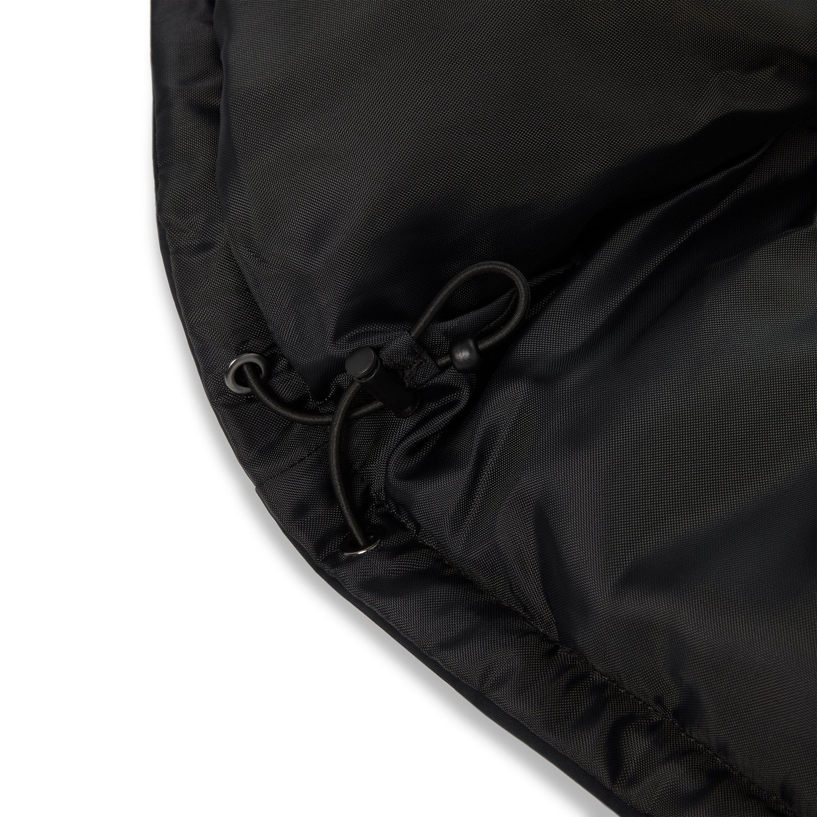 Black poly-fill puffer jacket with internal drawstring hem for adjustable fit.