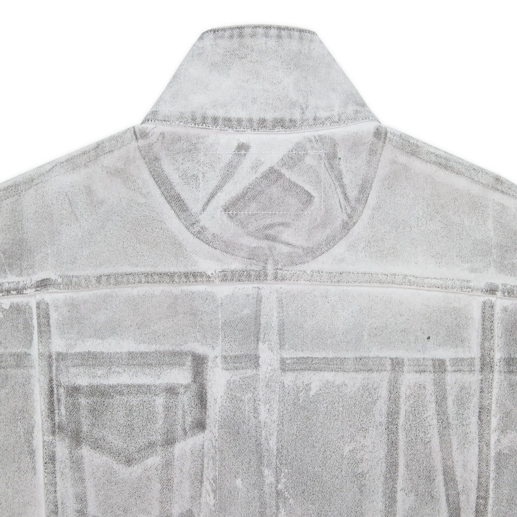 Back of a platinum trucker jacket with spray-effect denim, contrast seams, and structured fit.