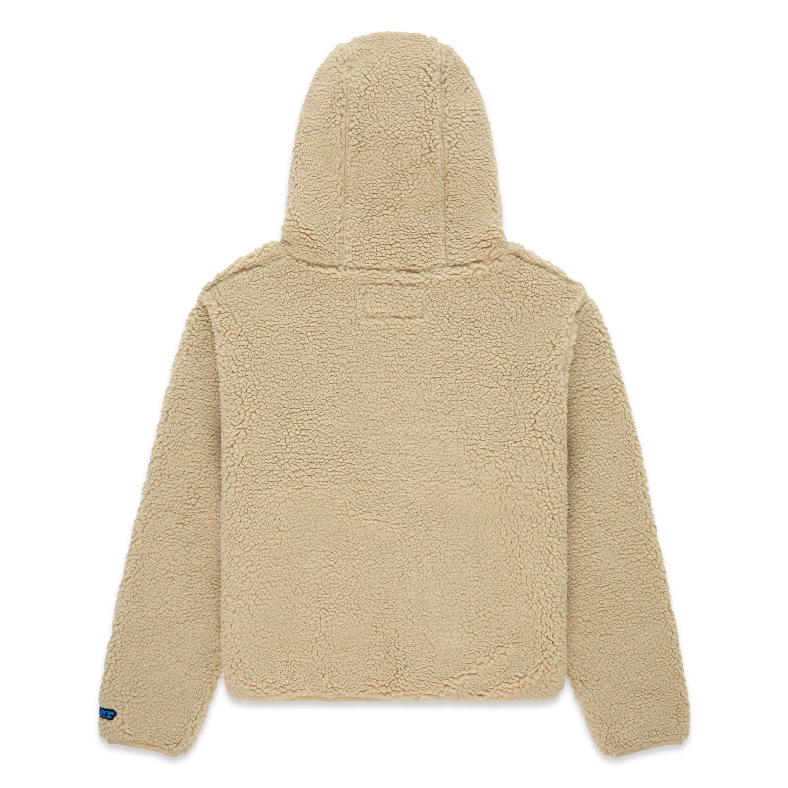 Back of a beige teddy sherpa fleece zip-up hooded jacket with a rubberized logo patch on the left wrist.