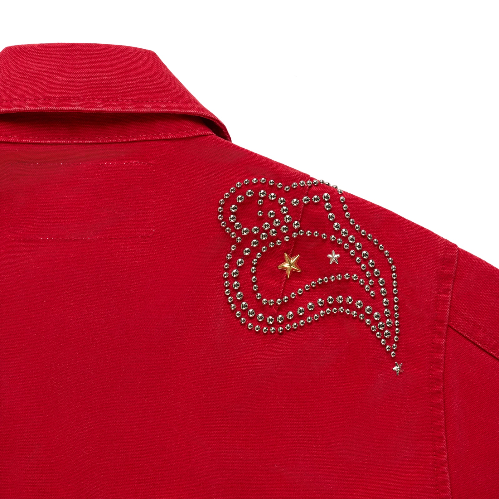 Red cotton canvas bomber jacket with silver studded shoulder detailing and gold stars.