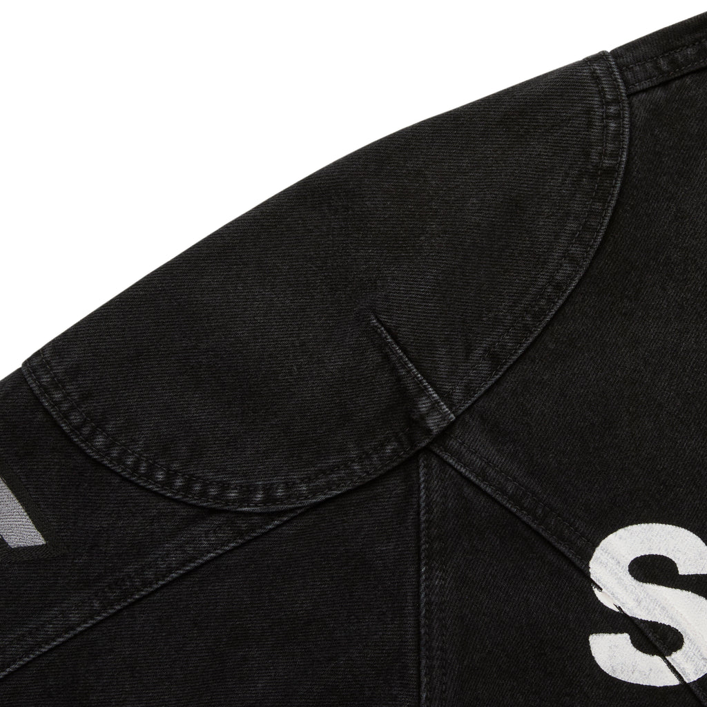 Faded black denim jacket with shoulder panel, SP5DER print, and star print.