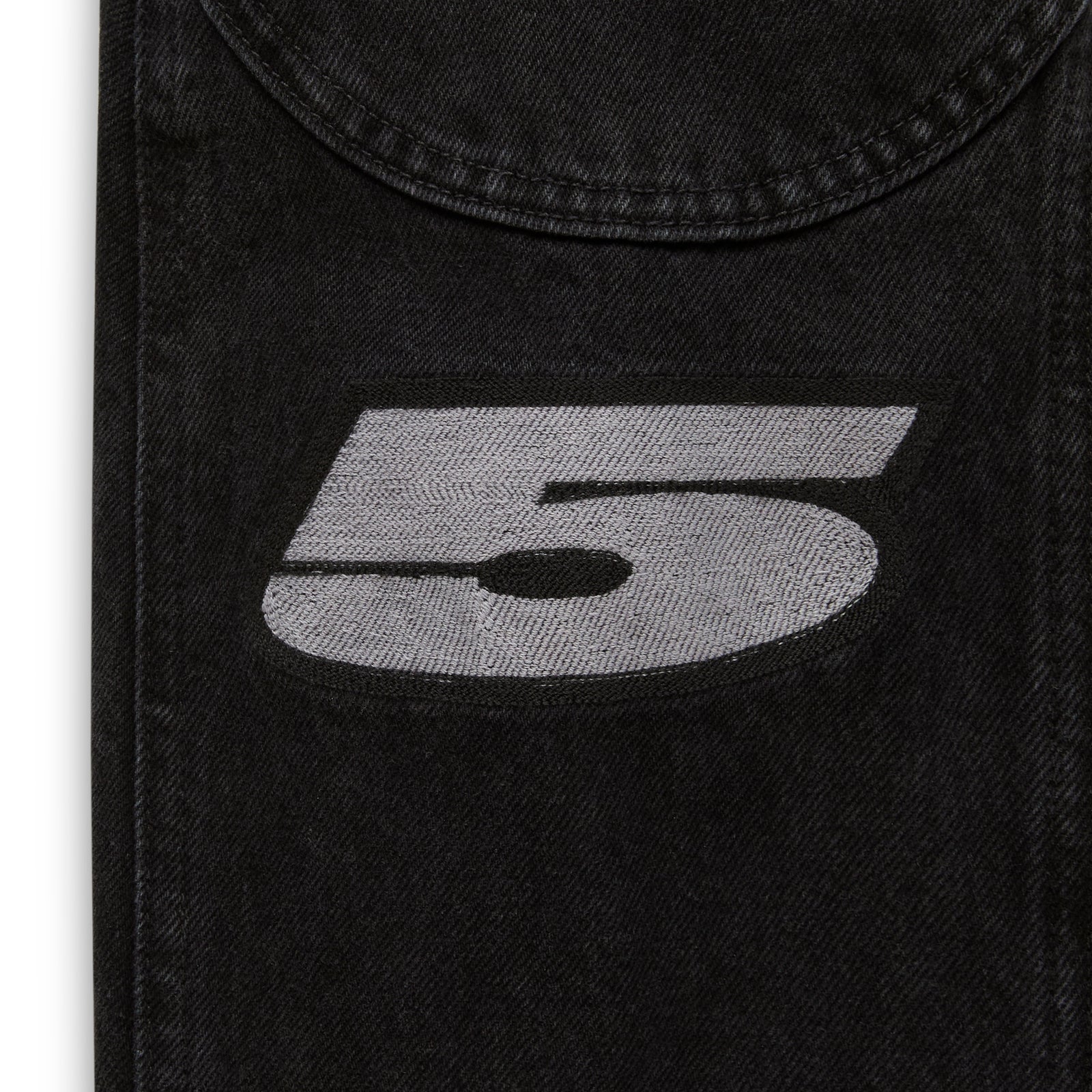 Faded black denim jacket with a large gray embroidered "5" and a curved pocket flap.