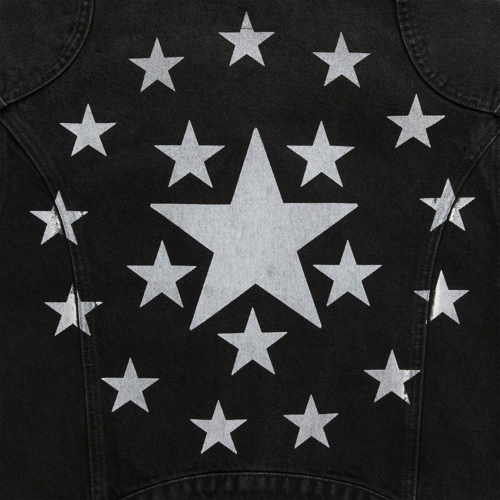 Black faded wash denim jacket back with large central star and smaller stars surrounding it.