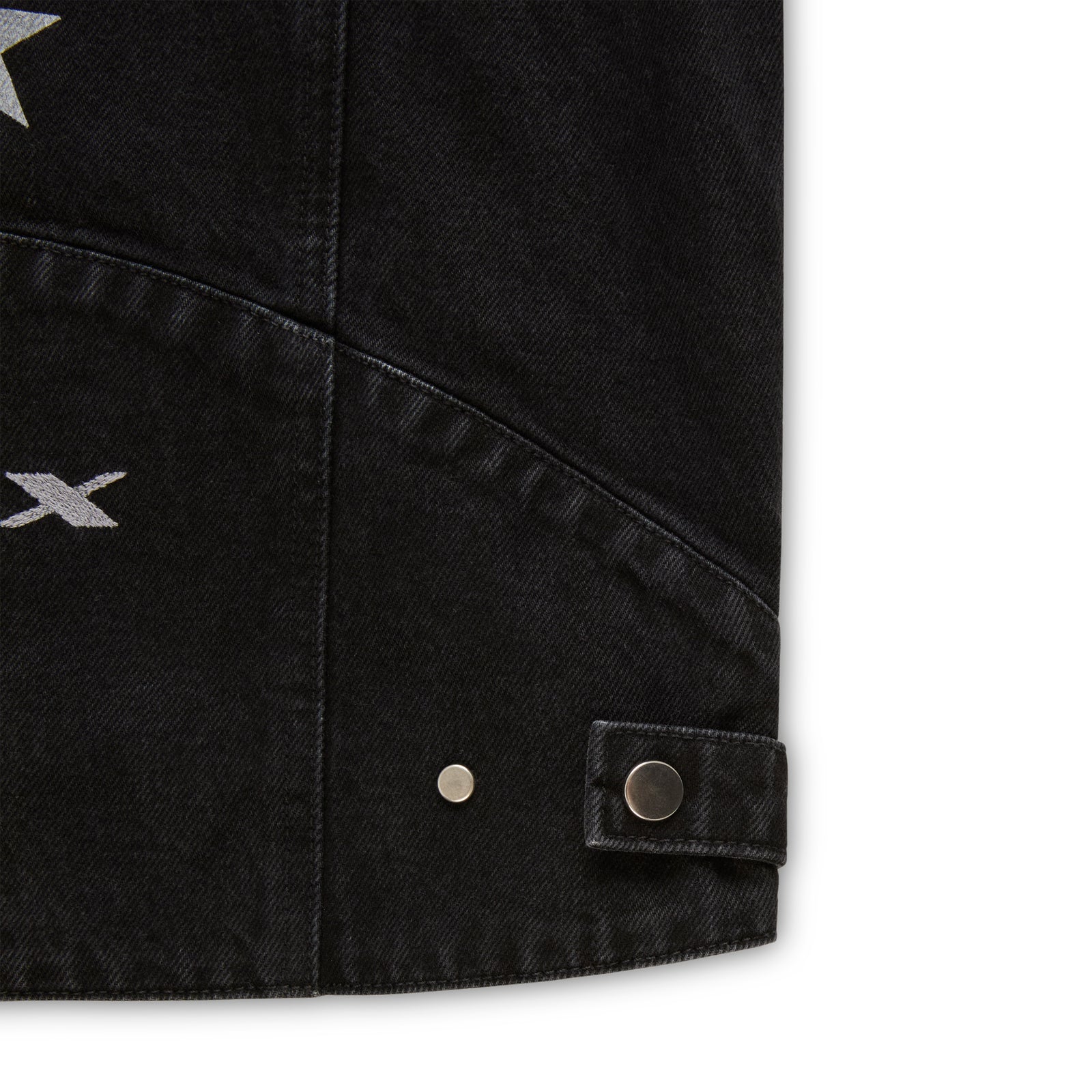 Faded black denim jacket with silver star print, SP5DER logo, and press-stud details.