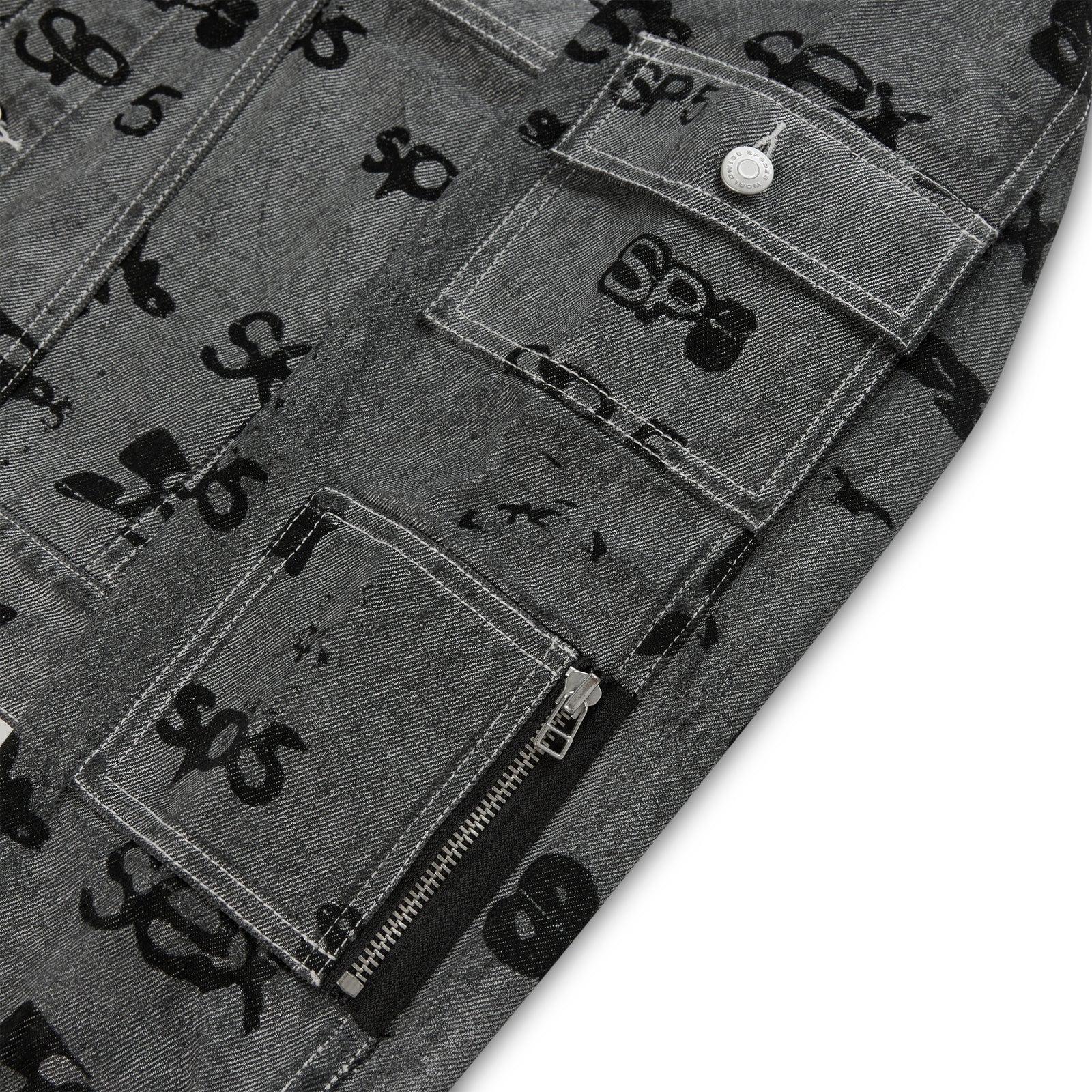Gray denim jacket with black all-over print, flap, and zip pockets, red contrast stitching.