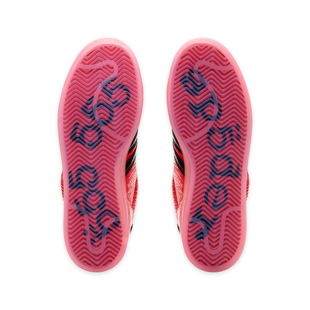 SP5DER x ADIDAS SUPERSTAR sneakers with translucent red outsoles featuring dark graphic detailing.
