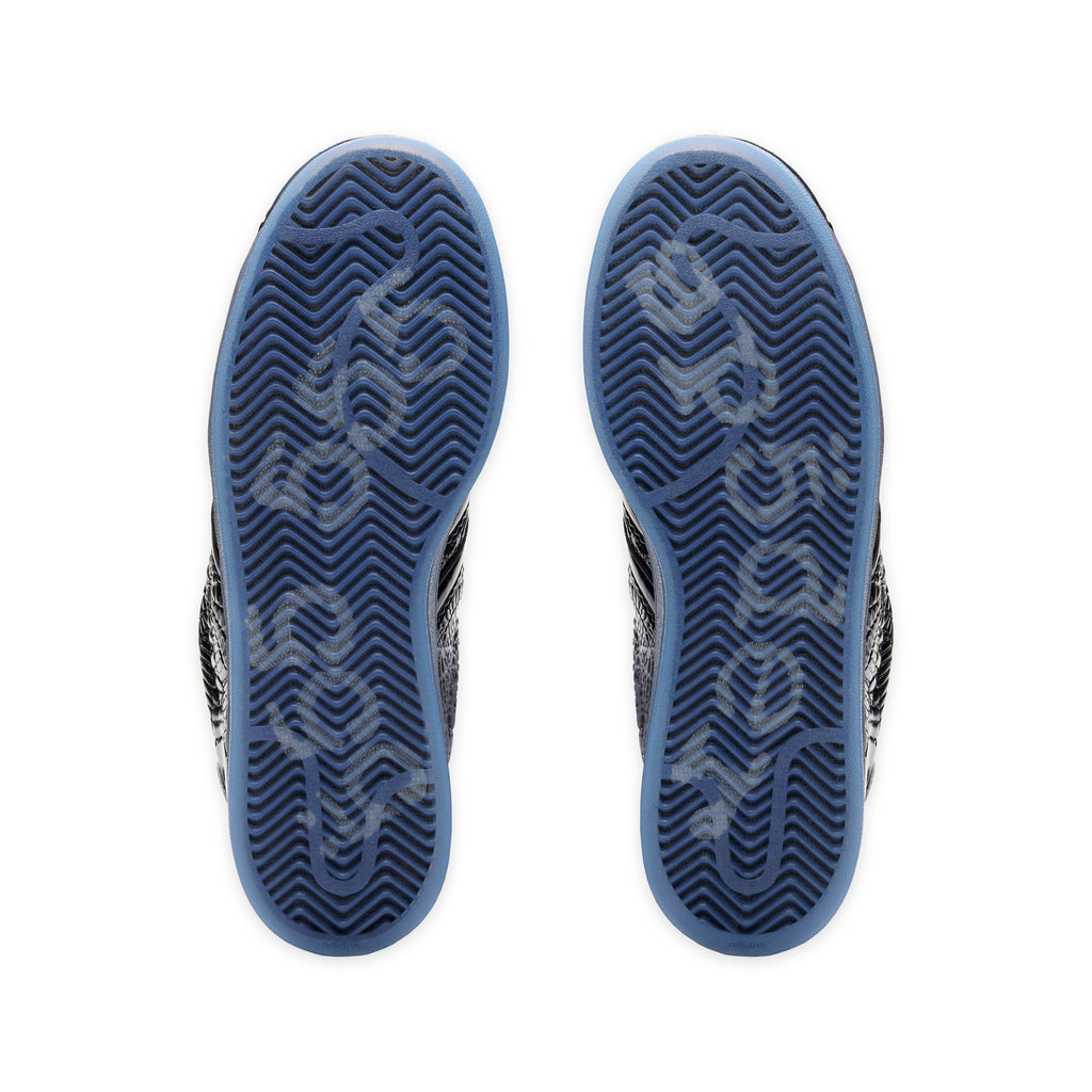 SP5DER x ADIDAS SUPERSTAR sneakers with translucent blue outsoles and tonal graphic detailing.