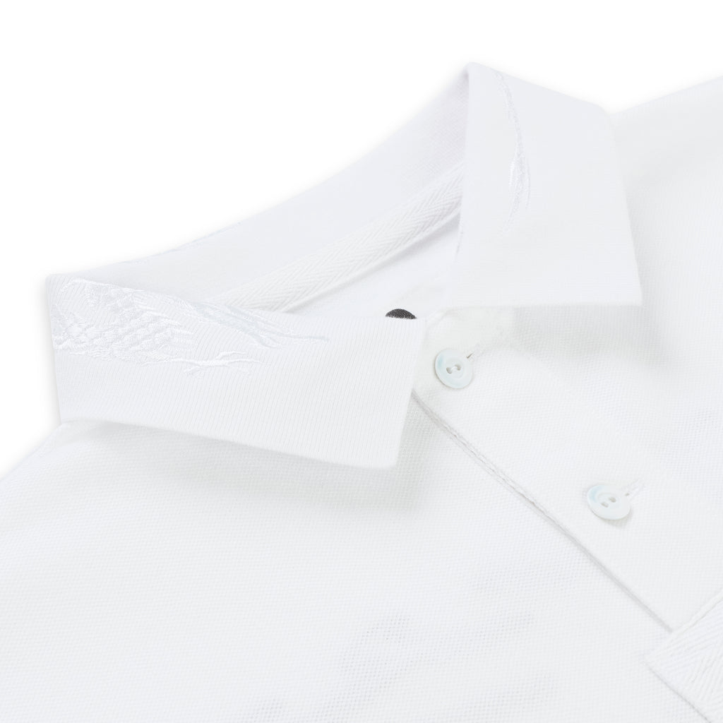 White pique polo shirt with an embroidered collar and three light buttons.