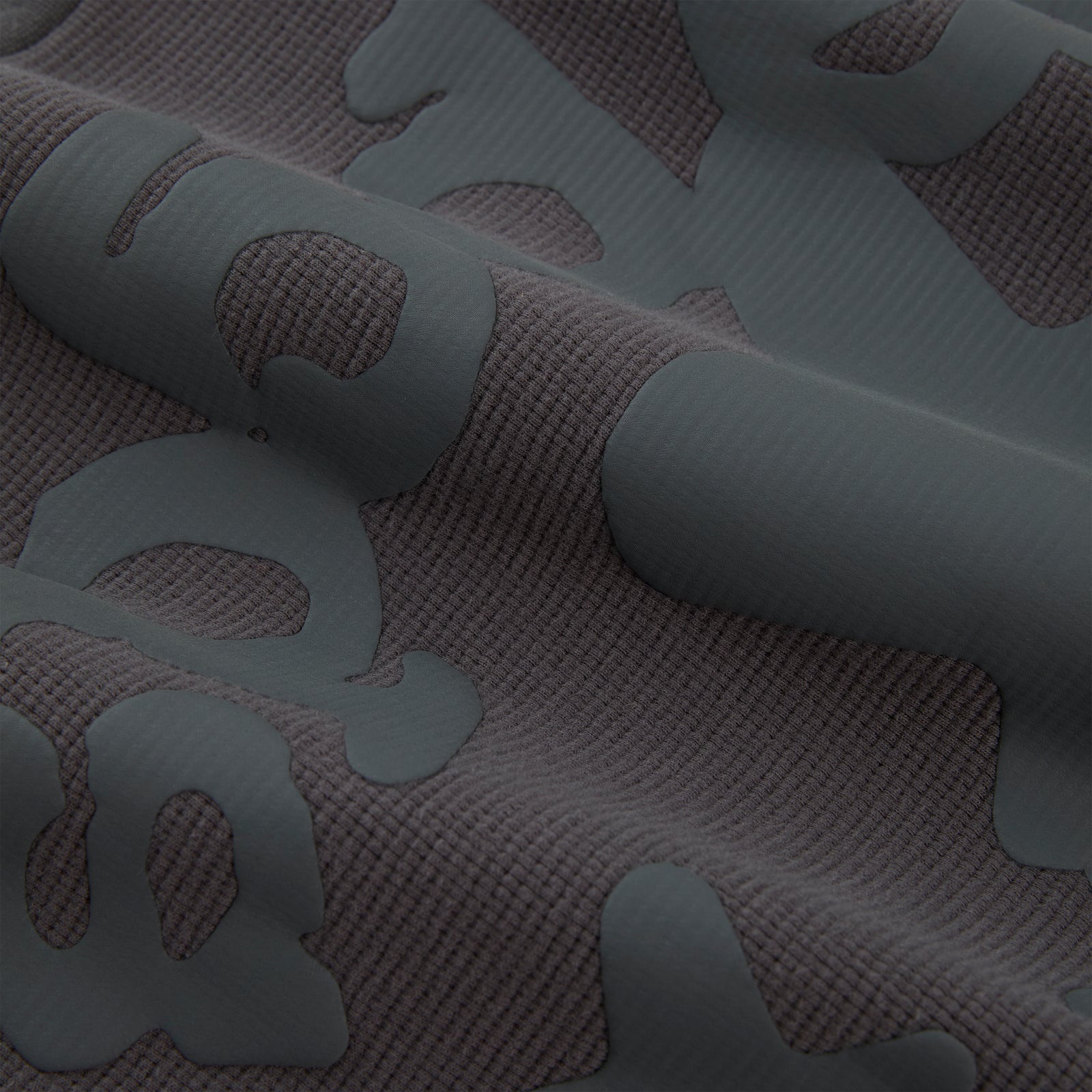 BELUGA THERMAL waffle knit fabric with raised dark gray Beluga print.