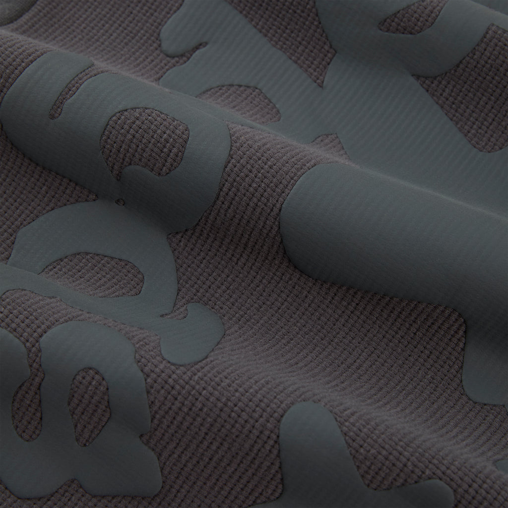 BELUGA THERMAL waffle knit fabric with raised dark gray Beluga print.