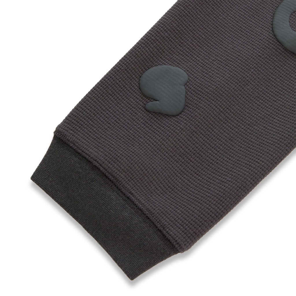 Dark grey waffle knit thermal sleeve with ribbed cuff and raised Beluga print.