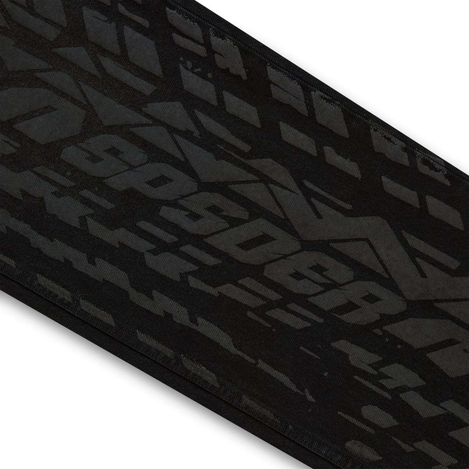 Black denim pant with all-over dark gray tire track design.