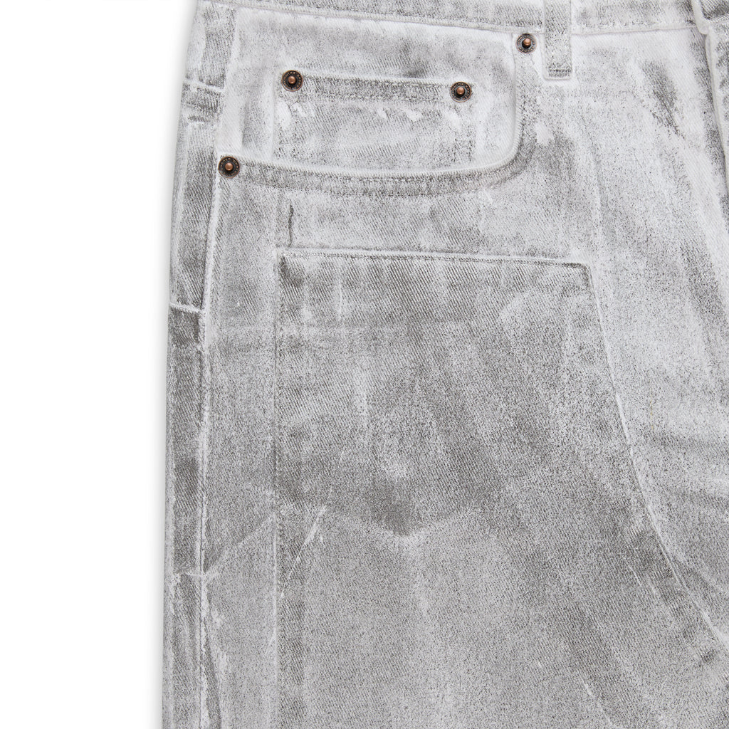 Platinum wide-leg denim pant with spray effect, front panels, and custom hardware.