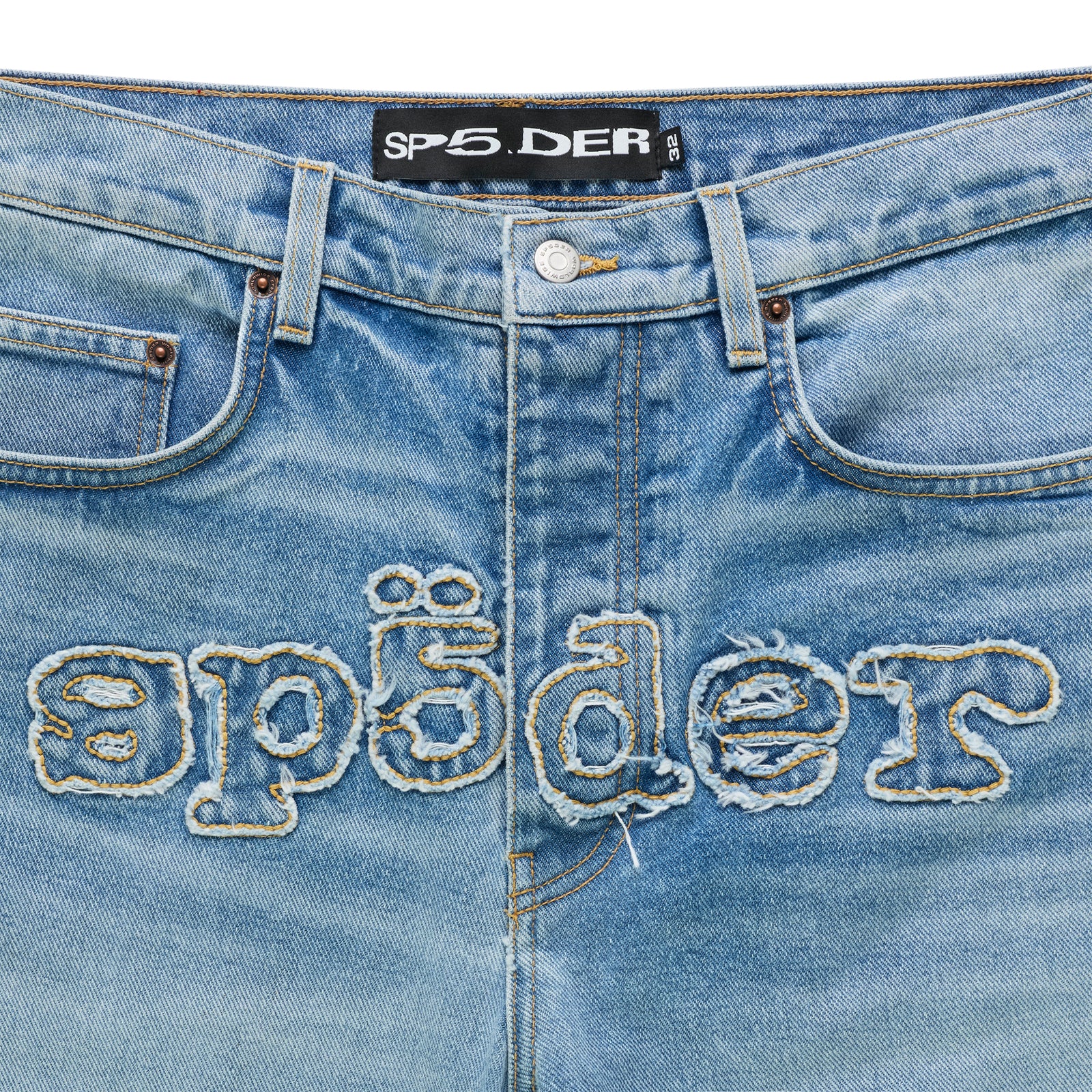 Light wash distressed denim jeans with frayed "SP5DER" logo embroidery across the crotch.