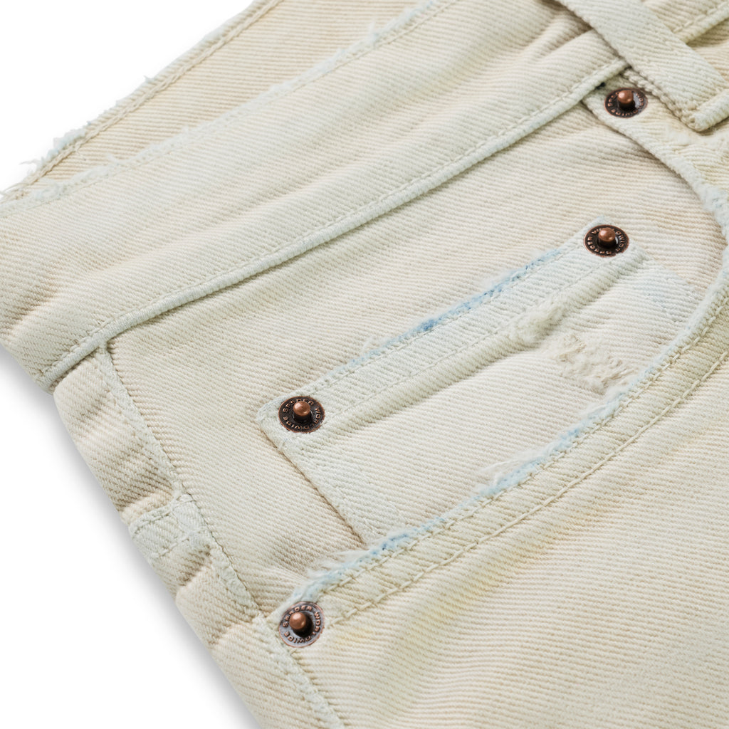 OXY JEAN 13oz light denim pant with custom branded hardware and distressed pockets.