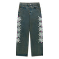 WEBSTONE DENIM 13oz vintage wash straight leg jeans with white web print and colorful rhinestone embellishments.