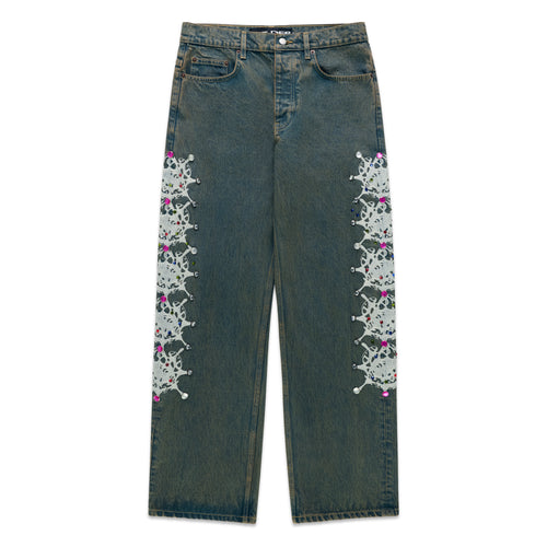 WEBSTONE DENIM 13oz vintage wash straight leg jeans with white web print and colorful rhinestone embellishments.