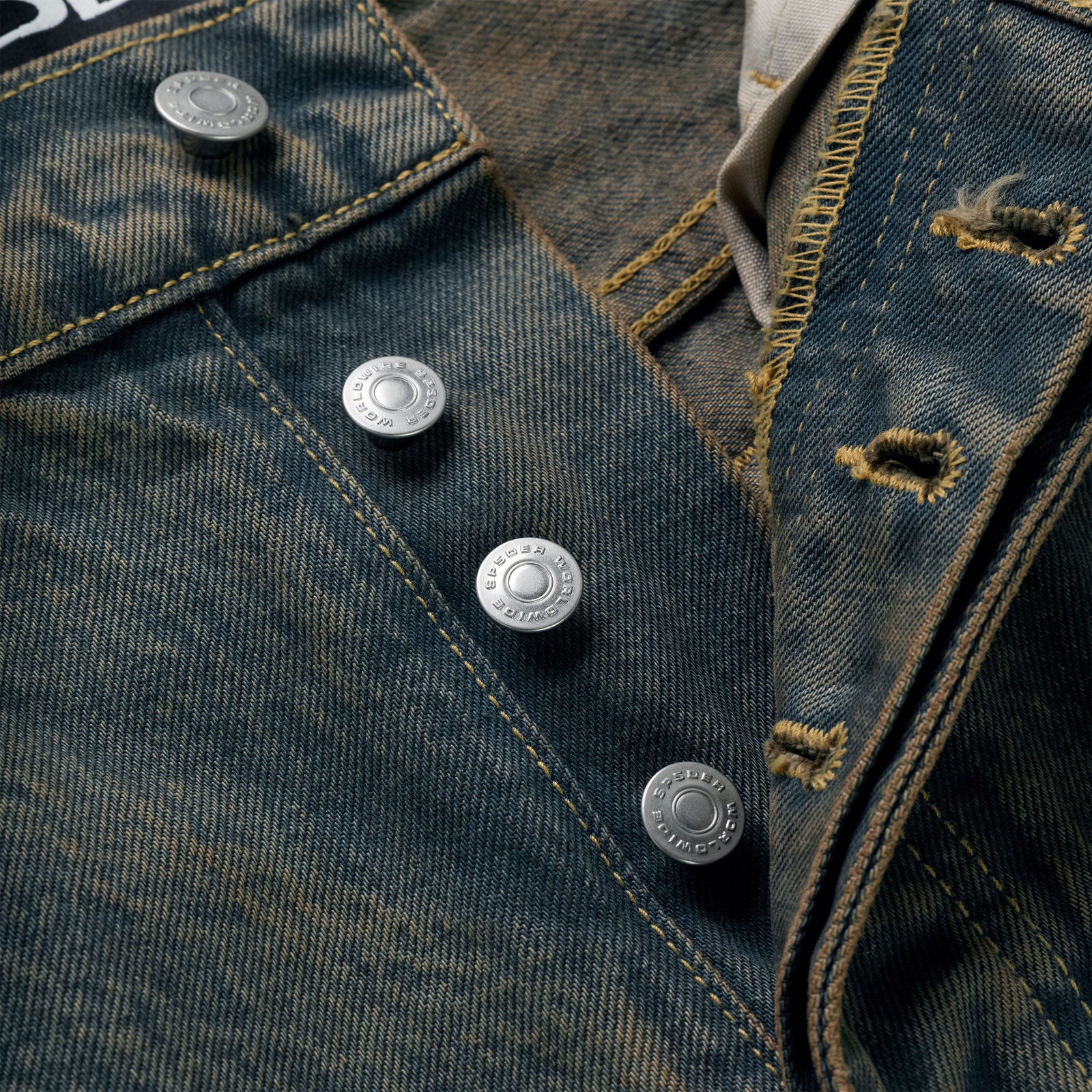 Close-up of vintage wash 13oz denim pants with branded shank buttons on the fly.
