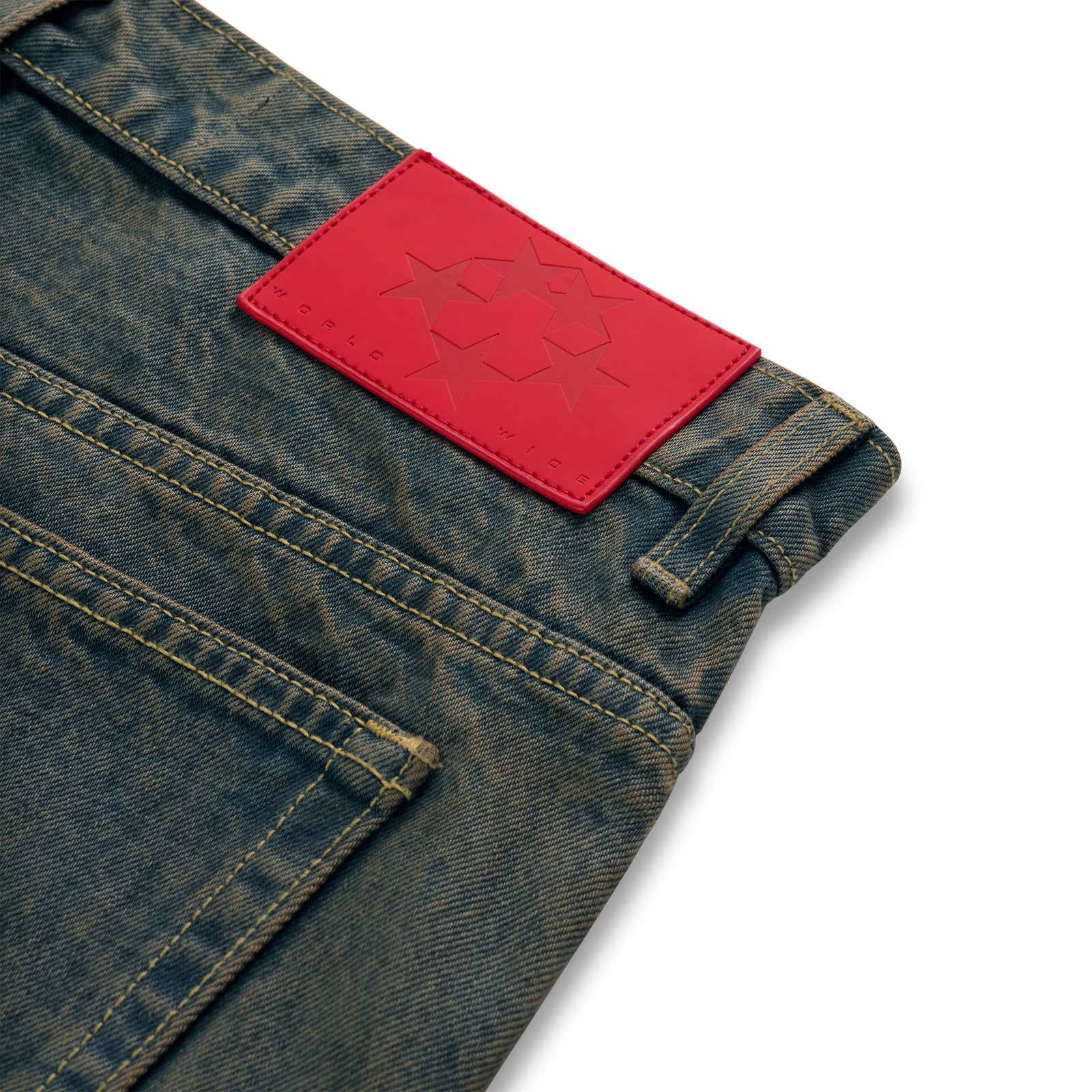 Vintage wash 13oz denim pants with a red leather back patch featuring star debossing.