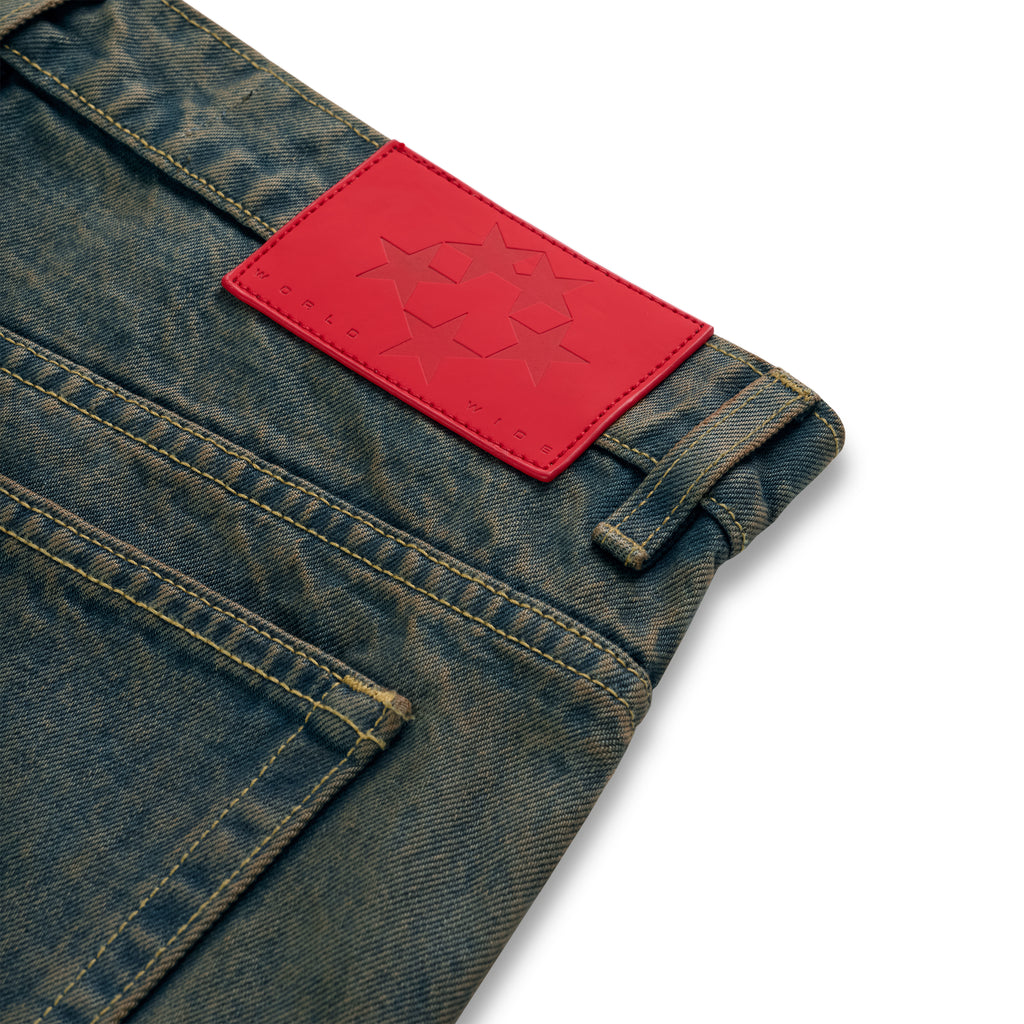 Vintage wash 13oz denim pants with a red leather back patch featuring star debossing.