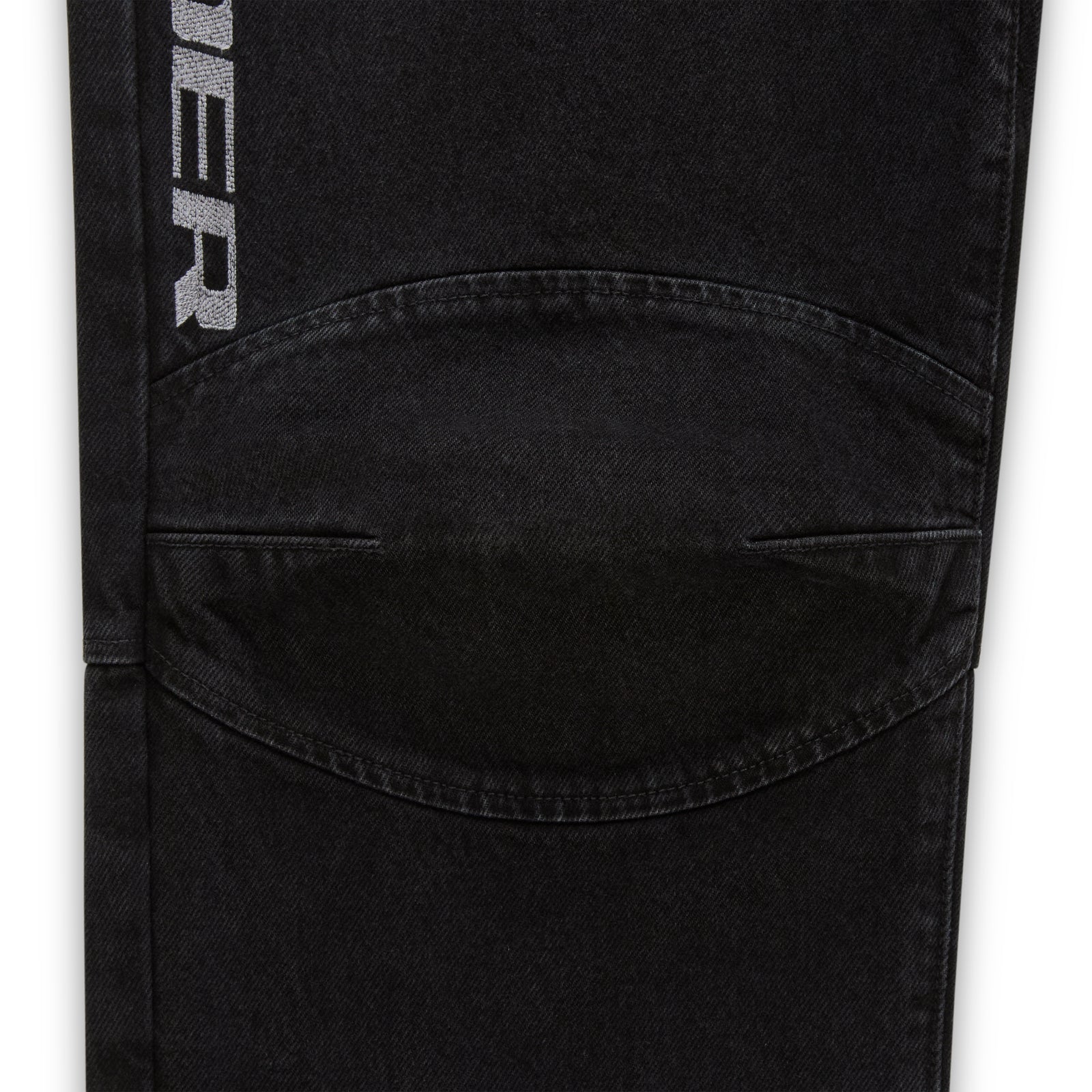 Faded black denim pant with "SP5DER" logo, paneled knee, and distressed details.