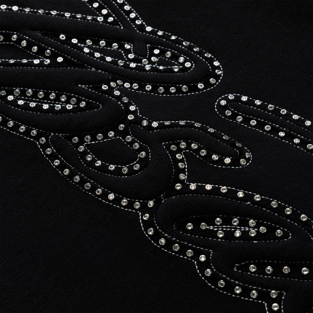 Black 100% cotton fleece sweatpant with rhinestone script text design down the leg.