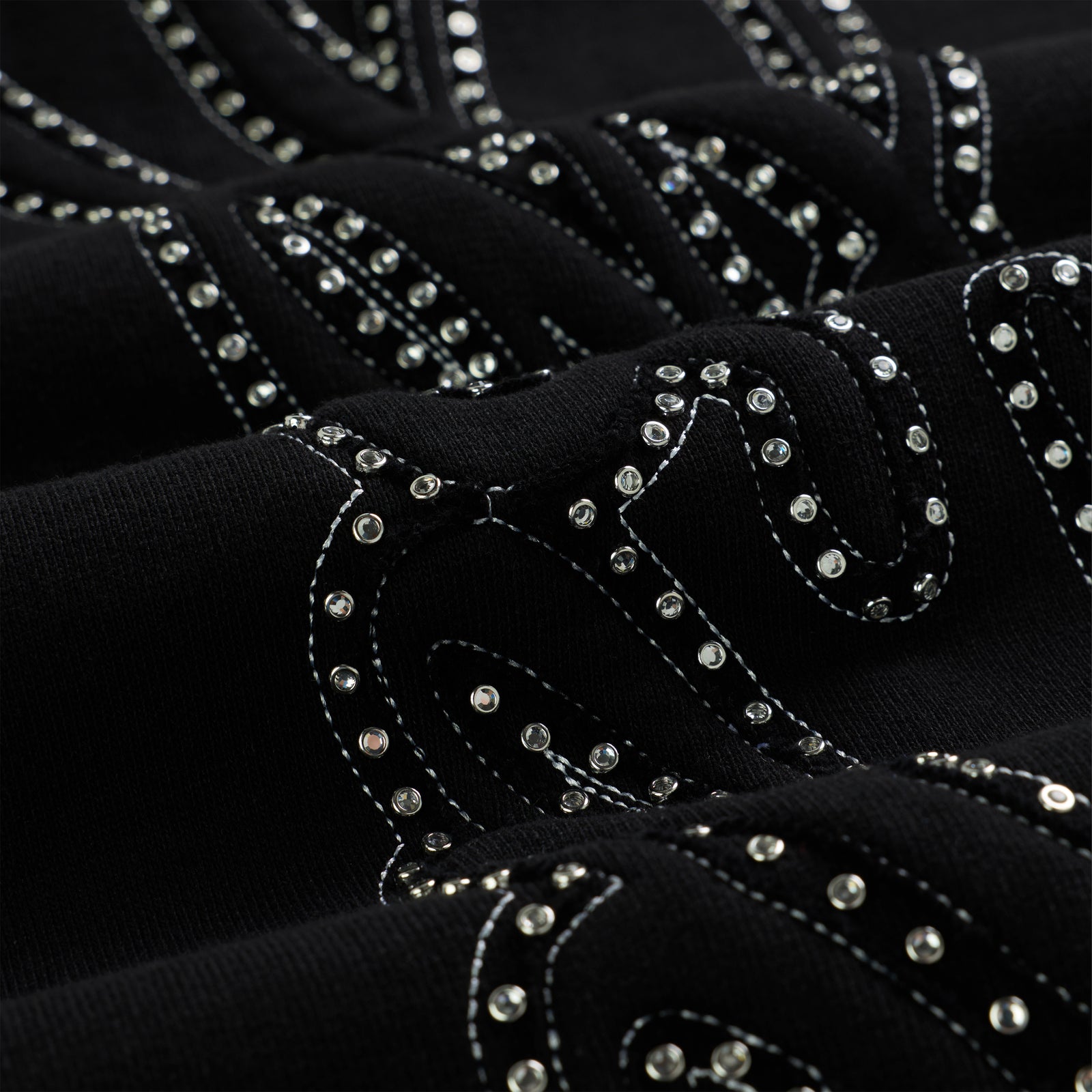 Black cotton fleece wide-leg sweatpant with rhinestone script text design.