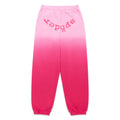 Pink ombre fleece sweatpants with "SP5DER" text at the crotch, elastic waistband, and cuffs.