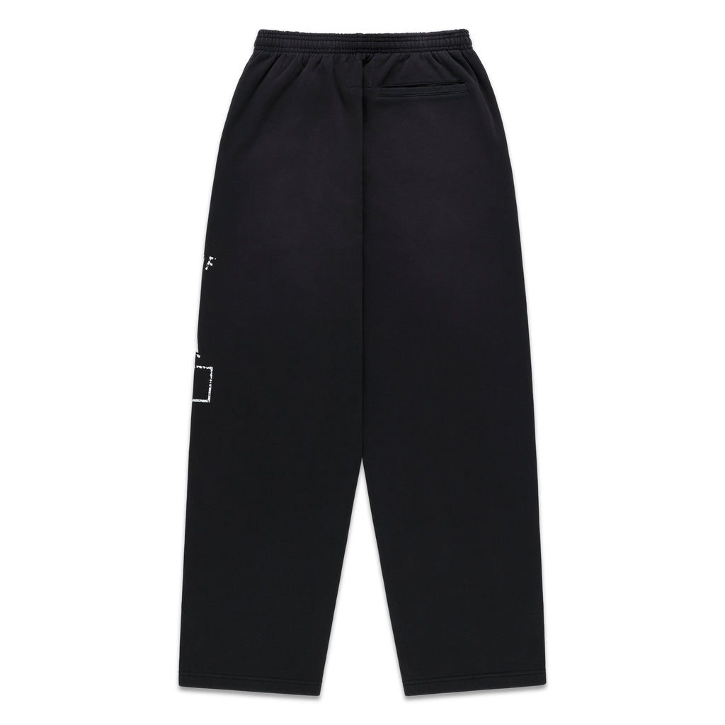 Black cotton fleece wide-leg sweatpants with faded white graphic print and elastic waistband.