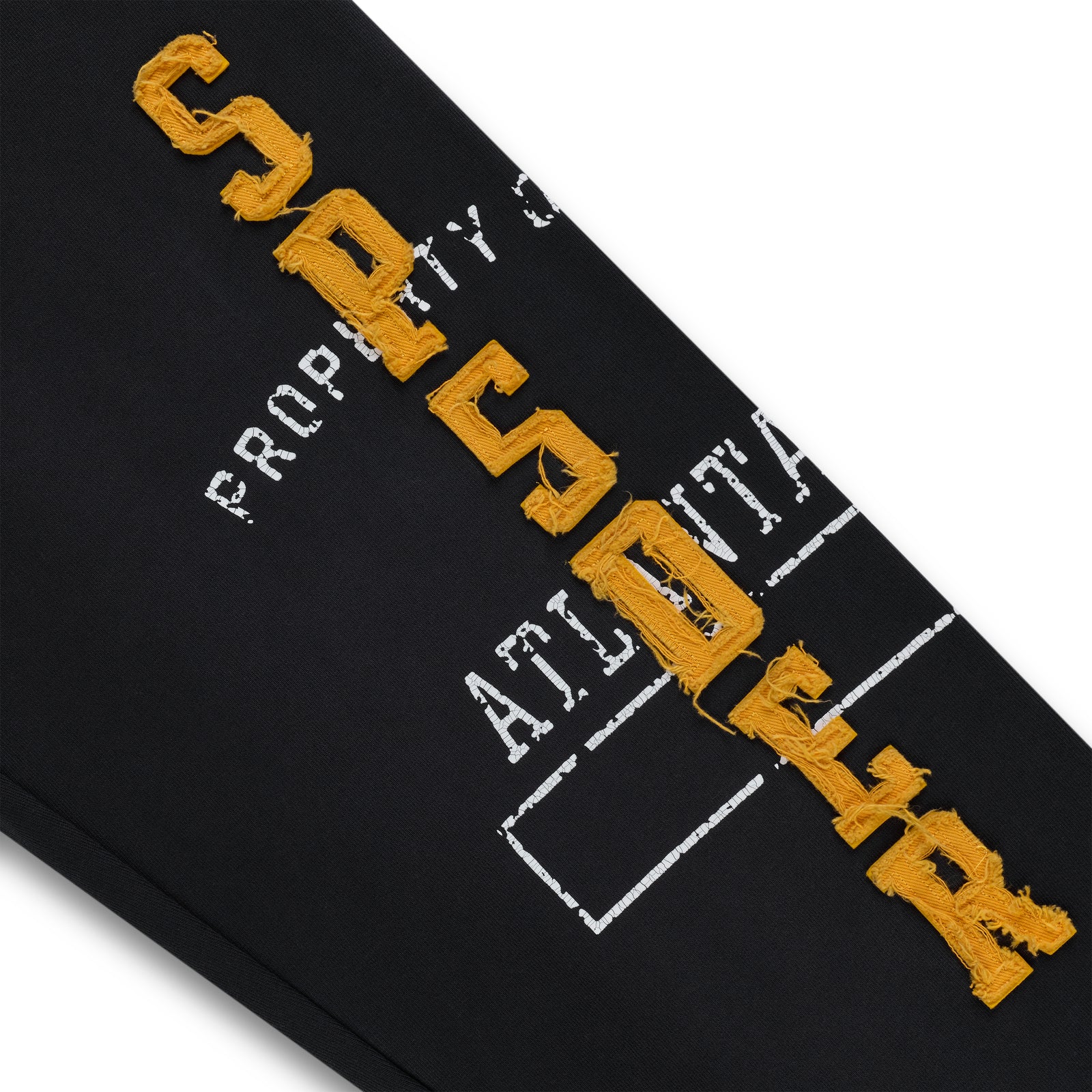 Black cotton fleece sweatpant with raised, frayed orange "SPSDER" lettering and faded white graphic print.