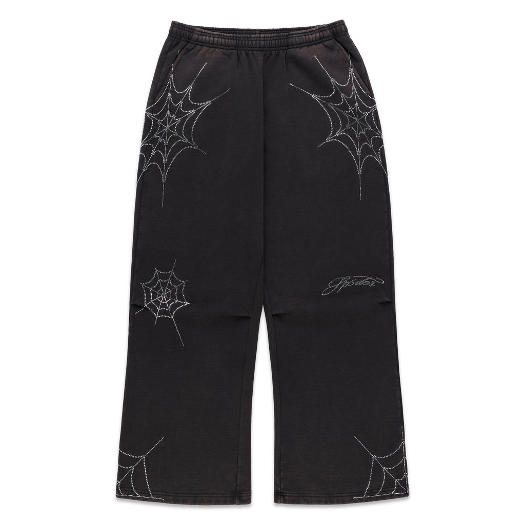 Black cotton fleece sweatpants with rhinestone web and text detail, wide-leg.