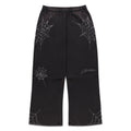 Black cotton fleece sweatpants with rhinestone web and text detail, wide-leg.