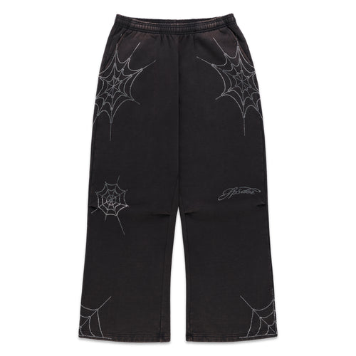 Black cotton fleece sweatpants with rhinestone web and text detail, wide-leg.