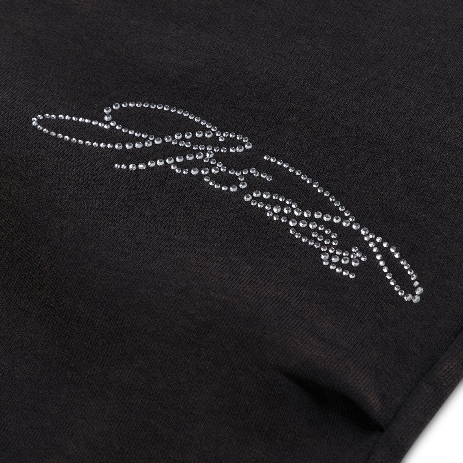 Black cotton fleece sweatpant with rhinestone web and text detail.