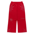 Red cotton fleece sweatpants with rhinestone spider web and text details, wide-leg silhouette.