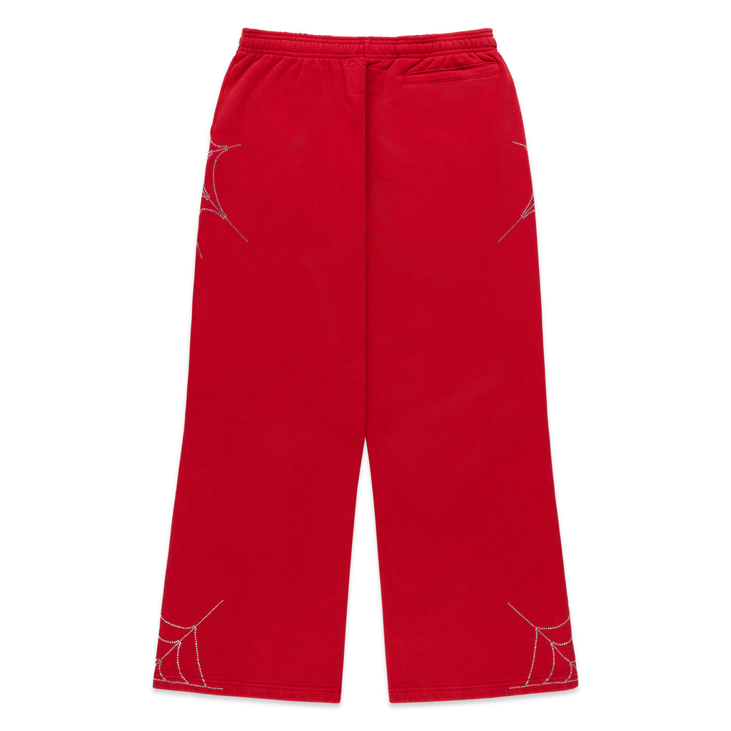 Red cotton fleece sweatpants with rhinestone spider web and text detail, wide-leg.