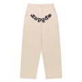 Beige cotton fleece sweatpants with "OG LOGO" appliqué across the crotch, embellished with mixed metal studs.