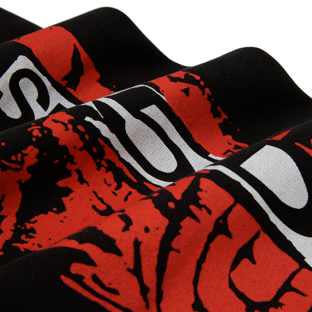 Black 13oz cotton fleece sweatpant with red and white painted moto design.