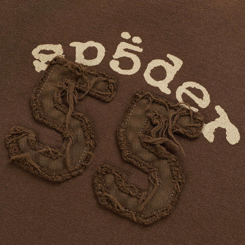 Brown cotton fleece sweatpants featuring a distressed 55 applique patch and arched graphic print.